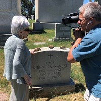 Kaya Mirecka Ploss at Jan Karski's grave at Mt. Olivet Cemetry in Washington, D.C., during the filming of the documentary Everything Is in Your Hands (holding the is camera its director, Sławomir Grünberg) (Photo: Courtesy of LOGTV/Sławomir Grünberg )