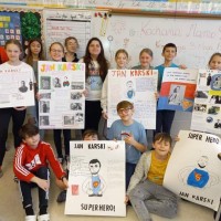Students from the Jan Karski Polish School in Palos Heights show off their Karski posters. (Photo: Courtesy of Marek Adamczyk)