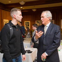 Andrzej Rojek talking to a Manhattan College student (Photo: Joshua Cuppek)