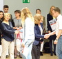 Joann Podolska and Ewa Junczyk-Ziomecka presenting students with promotional packets (Photo: Katarzyna Musur)