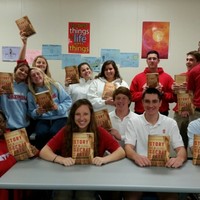 Charlotte Catholic HS students show off the donated copies of Karski's Story of a Secret State (Photo: Donna M. Tarney)