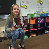 A student of the Polish Supplementary School in Rockaway Beach, NY, reads the graphic novel about Karski (Photo: Agnieszka Misior)