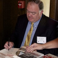 Tom Wood signs copies of his biography of Karski (Stacey Brazen)
