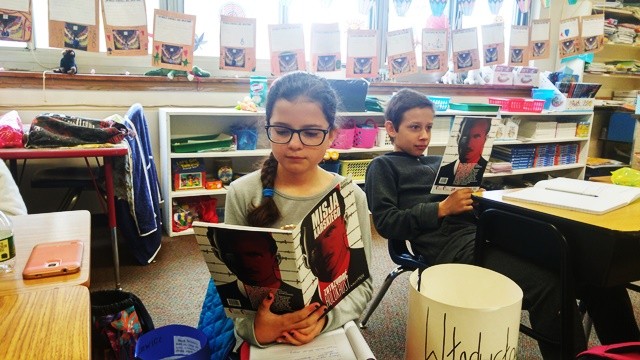 Students of the Polish Supplementary School in Rockaway Beach, NY, read the graphic novel about Karski (Photo: Agnieszka Misior)