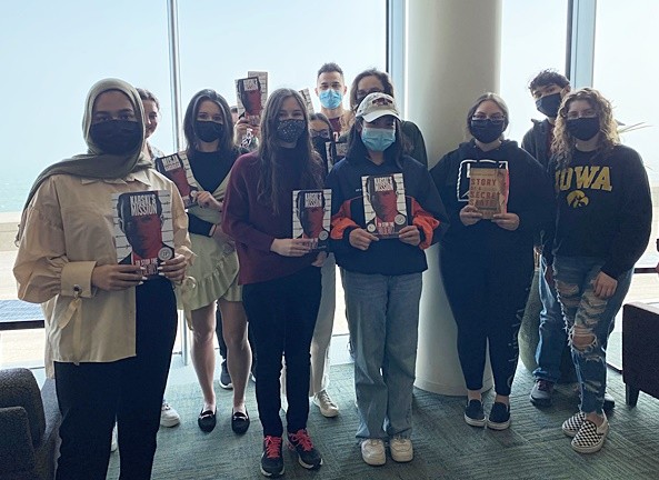 Loyola University Chicago students with the graphic novel “Karski’s Mission: To Stop the Holocaust”