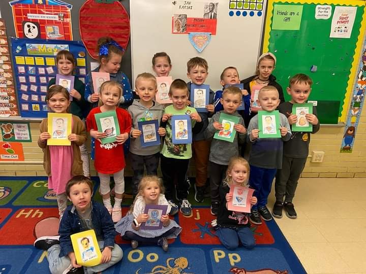 Students from the Jan Karski Polish School in Palos Heights show off their Karski artwork. (Photo: Courtesy of Marek Adamczyk)